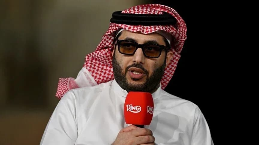 Shirted man speaking into microphone during interview Shirted man speaking into microphone during interview