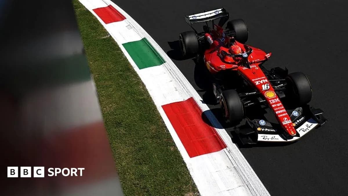 Formula 1 car navigating a corner on racetrack Formula 1 car navigating a corner on racetrack