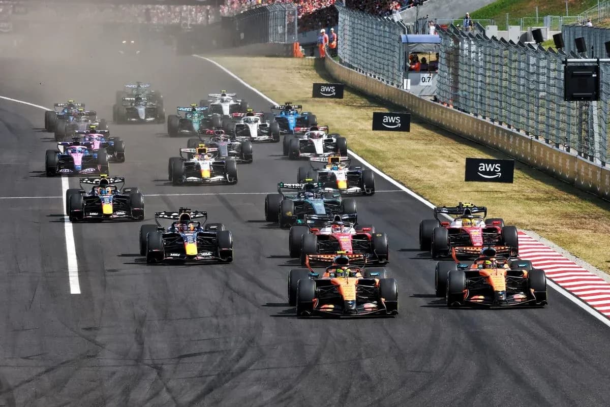 Formula 1 cars racing on track during competition Formula 1 cars racing on track during competition