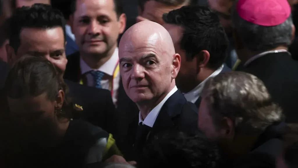 FIFA president surrounded by crowd at event FIFA president surrounded by crowd at event