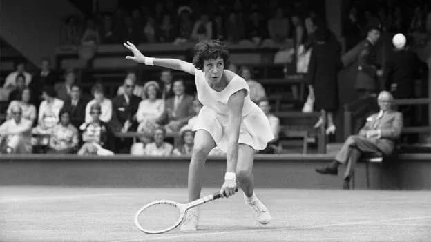 Tennis player hitting a forehand during match Tennis player hitting a forehand during match