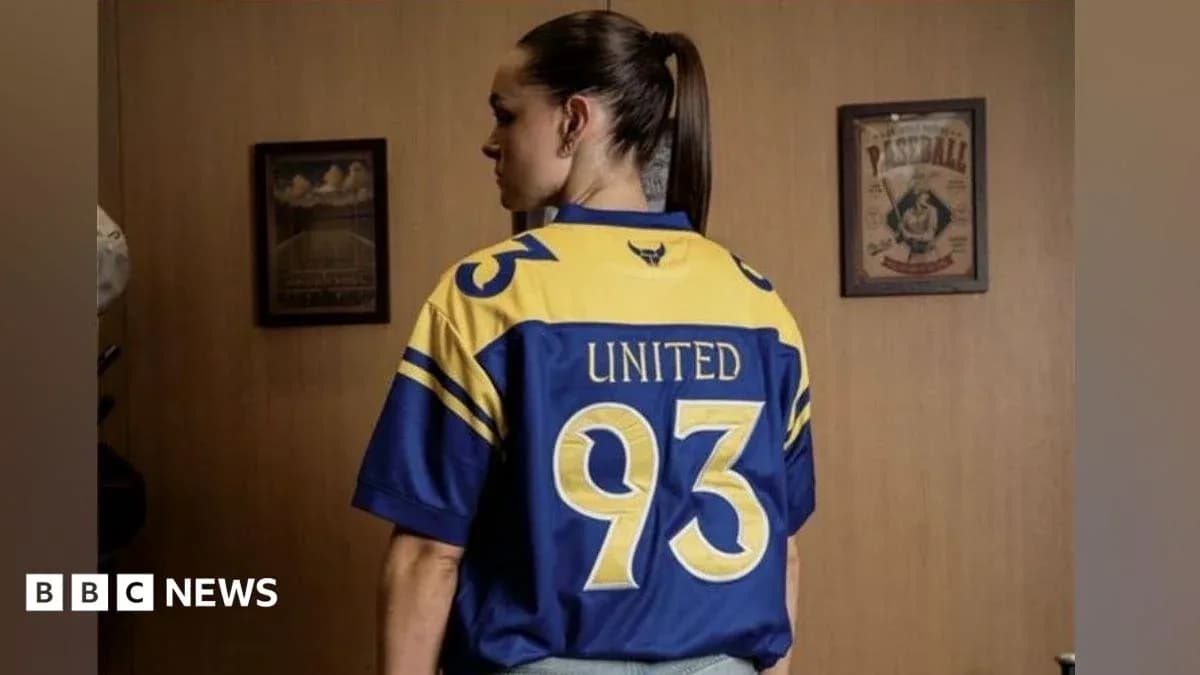 Person wearing blue and yellow sports jersey Person wearing blue and yellow sports jersey