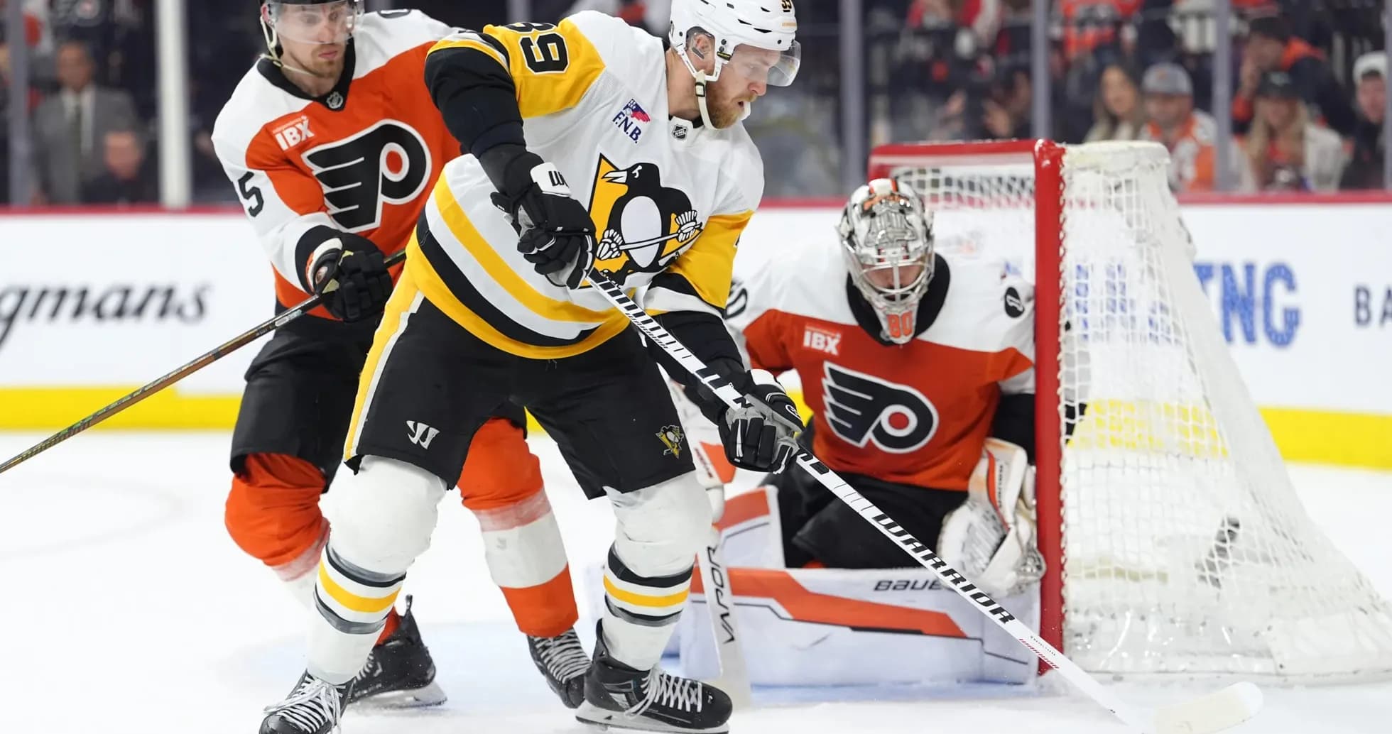 Hockey players competing for the puck in game Hockey players competing for the puck in game