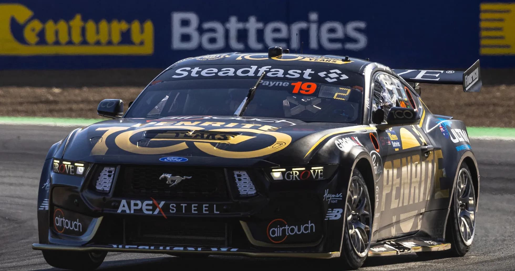 Ford Mustang racing car on track during competition Ford Mustang racing car on track during competition