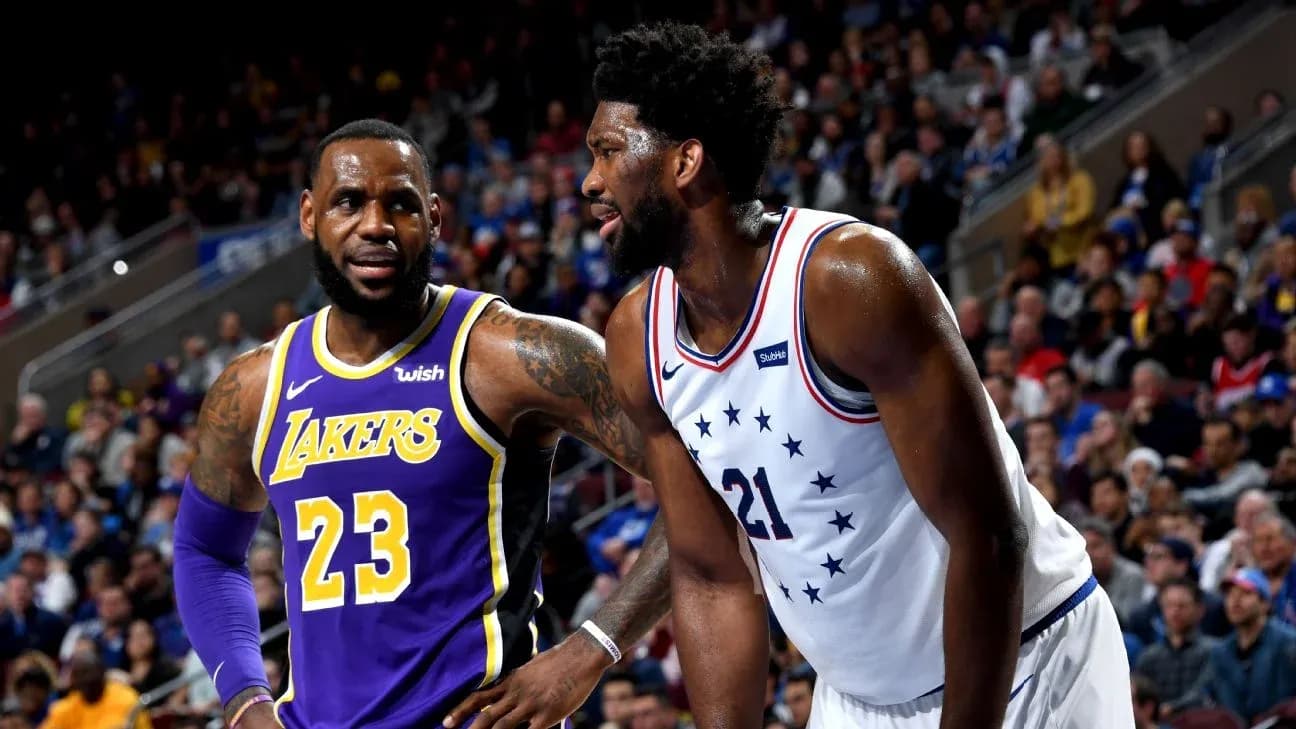 LeBron James and Joel Embiid during basketball game LeBron James and Joel Embiid during basketball game