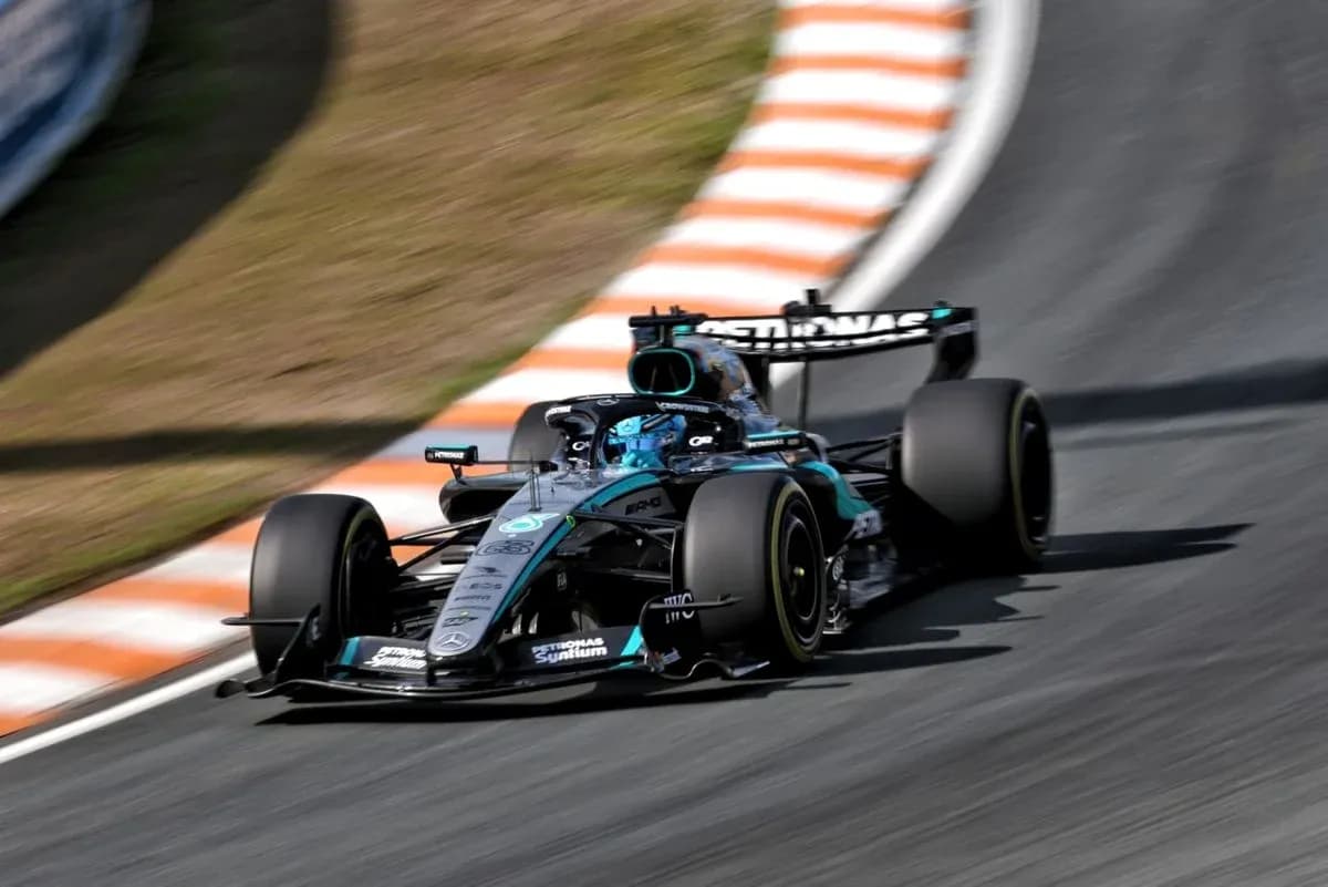 Formula 1 car navigating a curved track Formula 1 car navigating a curved track