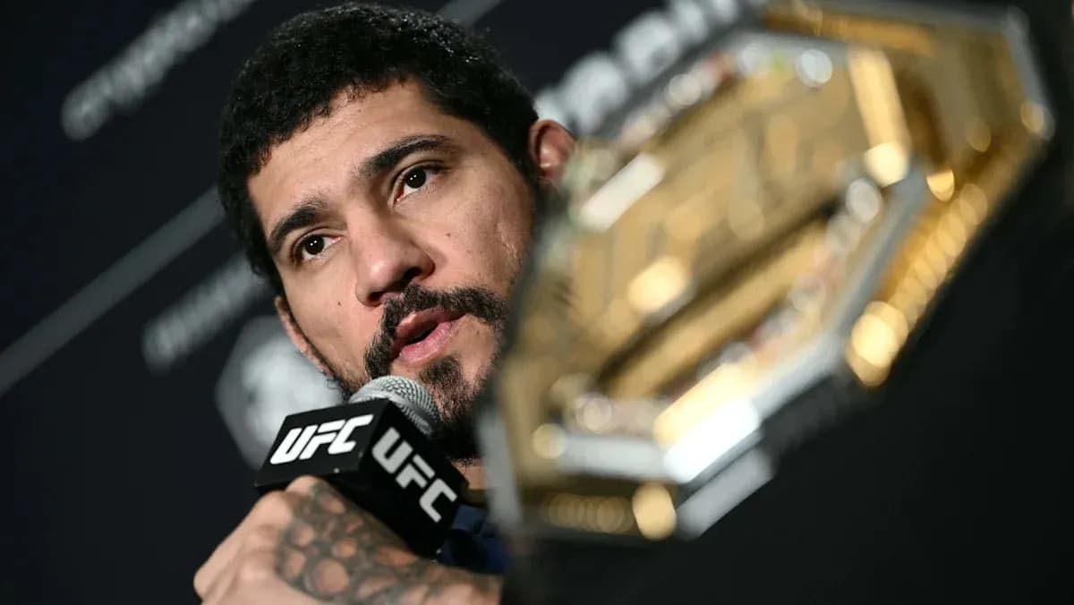 UFC fighter speaking into microphone at press conference UFC fighter speaking into microphone at press conference