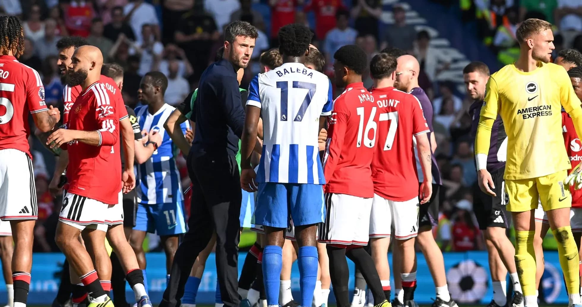 Players from both teams interacting after match Players from both teams interacting after match