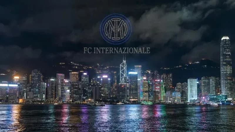 Hong Kong skyline illuminated at night with logo Hong Kong skyline illuminated at night with logo