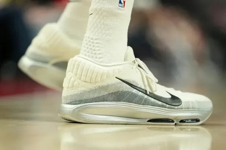 Close-up of basketball shoes on court floor Close-up of basketball shoes on court floor