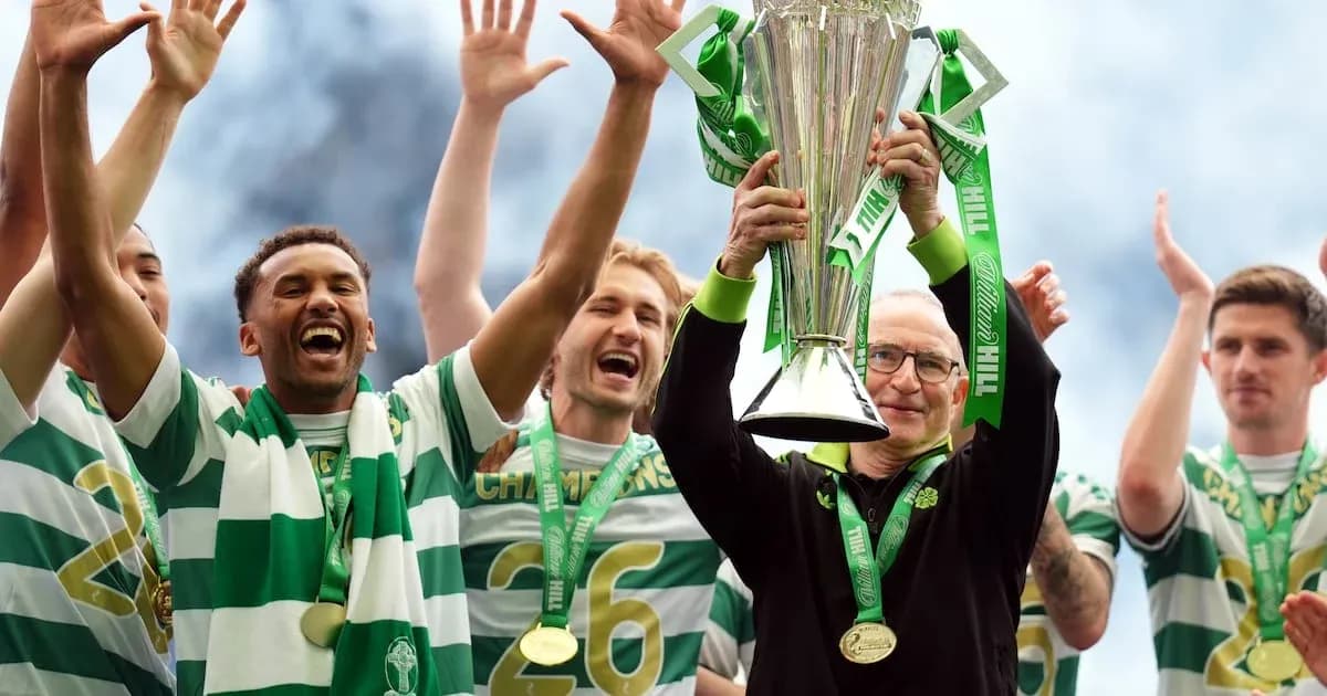 Celtic players celebrating trophy victory on stage Celtic players celebrating trophy victory on stage