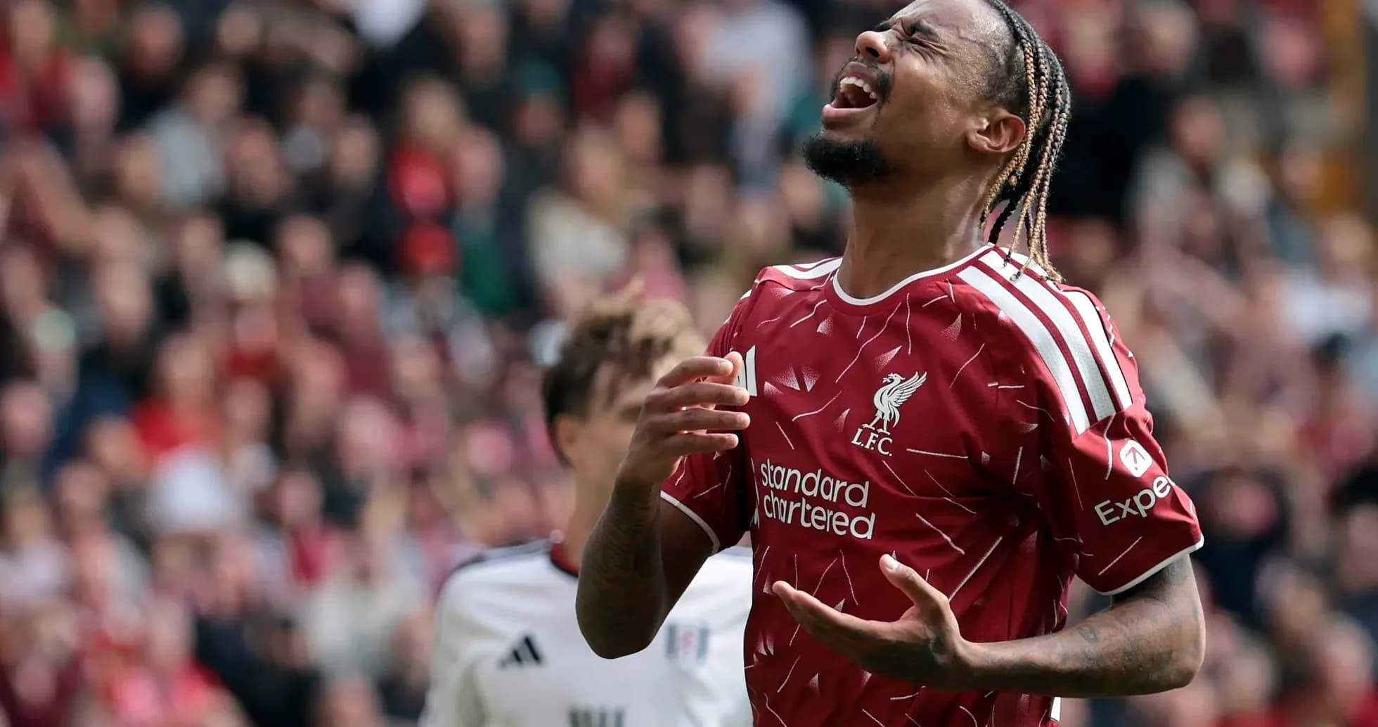 Liverpool player expressing frustration during match Liverpool player expressing frustration during match