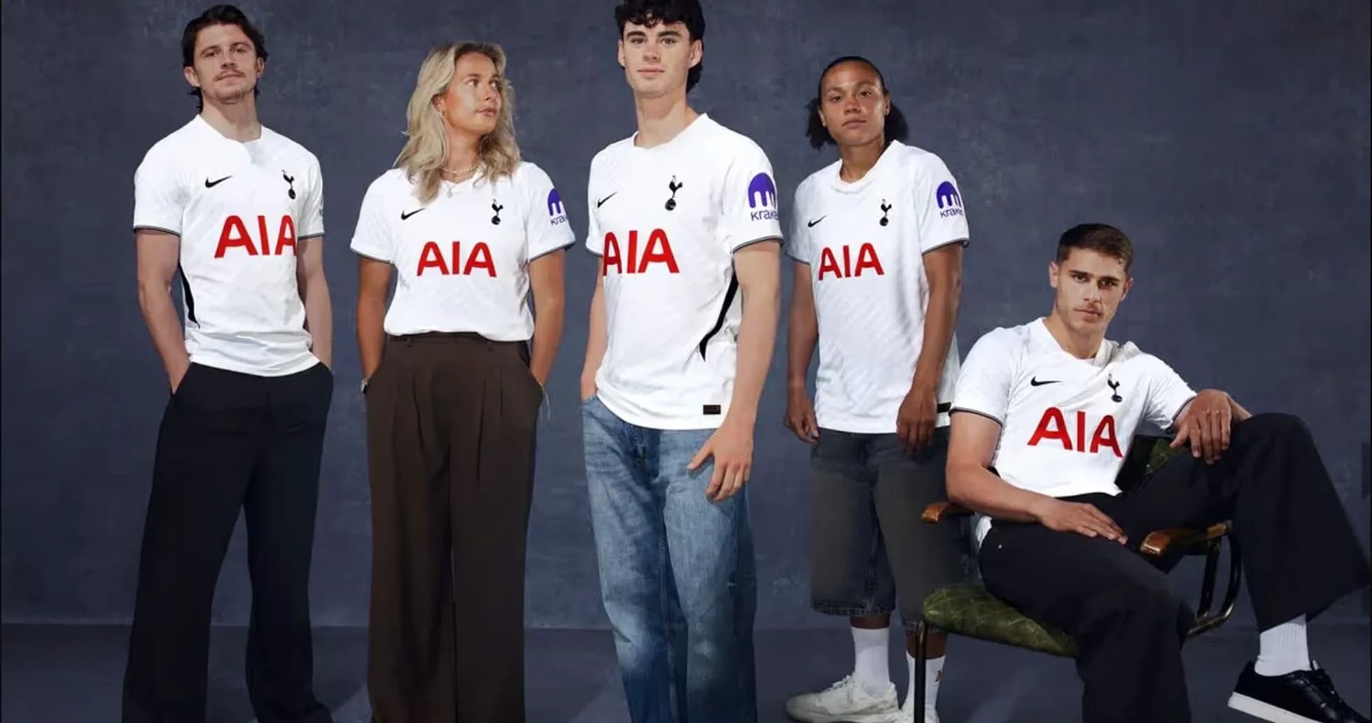 Five individuals wearing Tottenham jerseys posing together Five individuals wearing Tottenham jerseys posing together