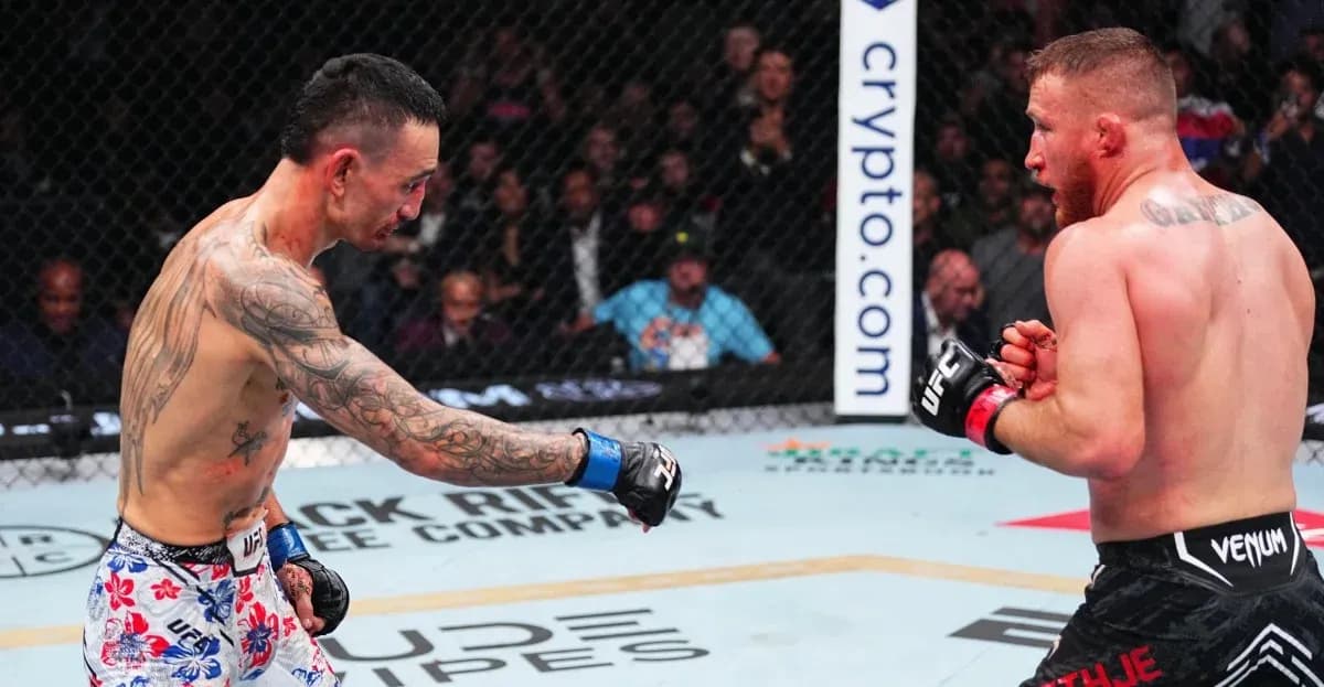Two fighters engaging in a match inside the octagon Two fighters engaging in a match inside the octagon