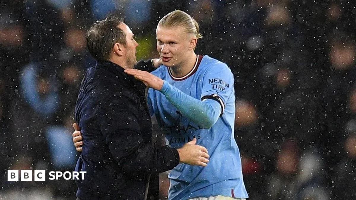Haaland and coach interacting during rainy match Haaland and coach interacting during rainy match