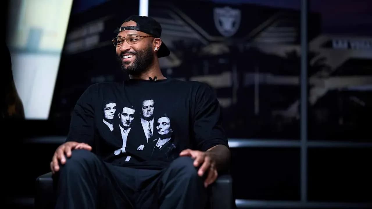 Basketball player in interview wearing graphic t-shirt Basketball player in interview wearing graphic t-shirt