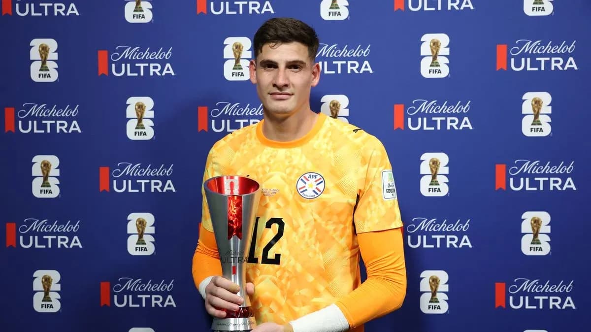 Goalkeeper holding trophy at post-match ceremony Goalkeeper holding trophy at post-match ceremony