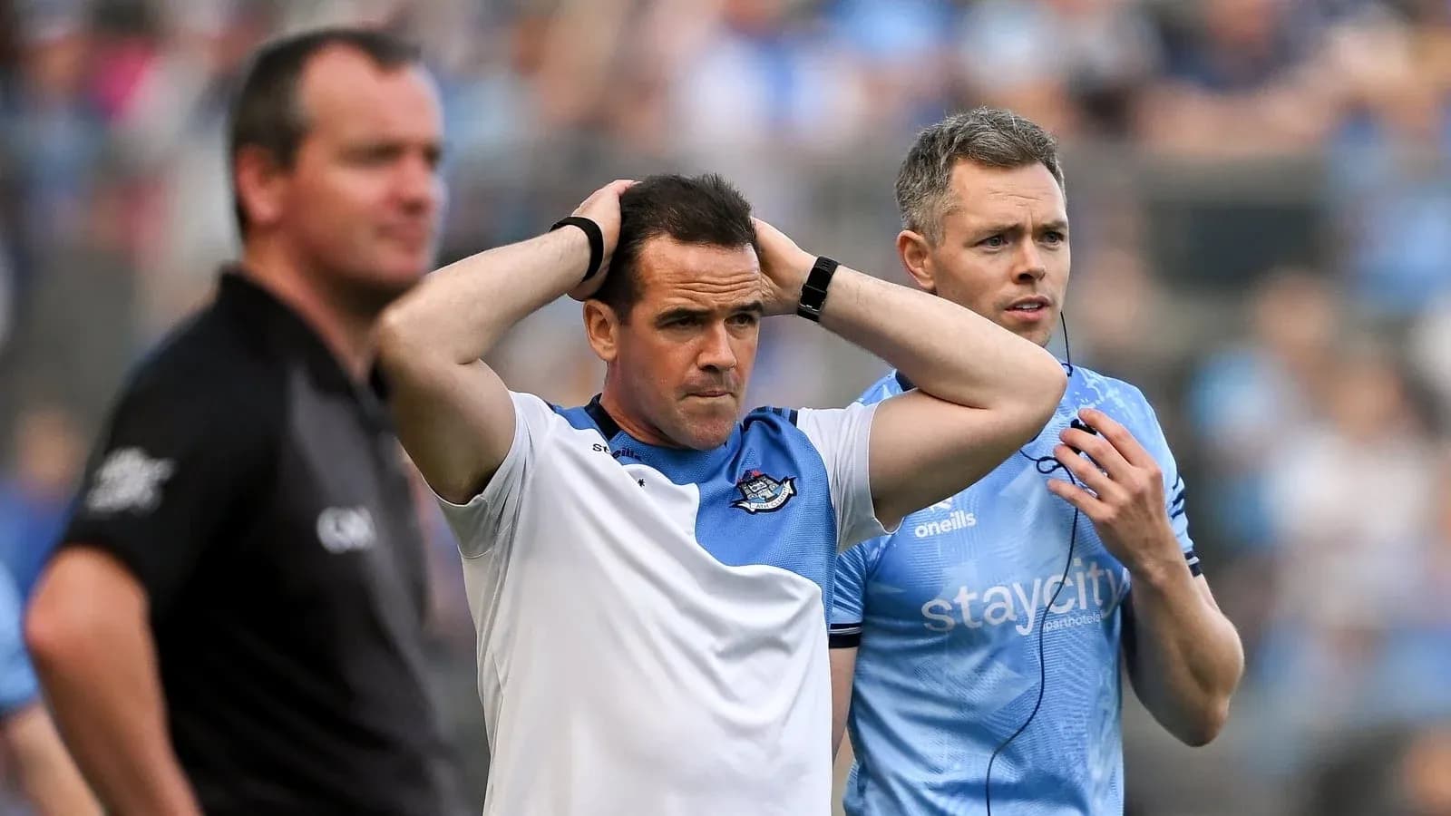 Coaches discussing during a tense moment in match Coaches discussing during a tense moment in match