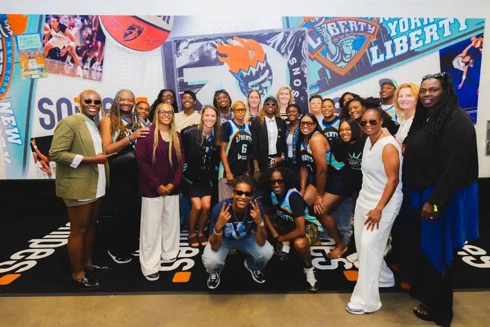 Group photo of New York Liberty supporters and players Group photo of New York Liberty supporters and players