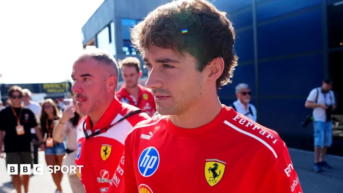 Formula 1 drivers walking in Ferrari team attire Formula 1 drivers walking in Ferrari team attire
