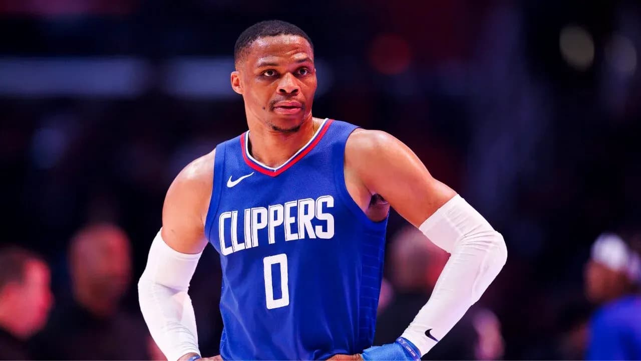 Basketball player in Clippers jersey on court Basketball player in Clippers jersey on court