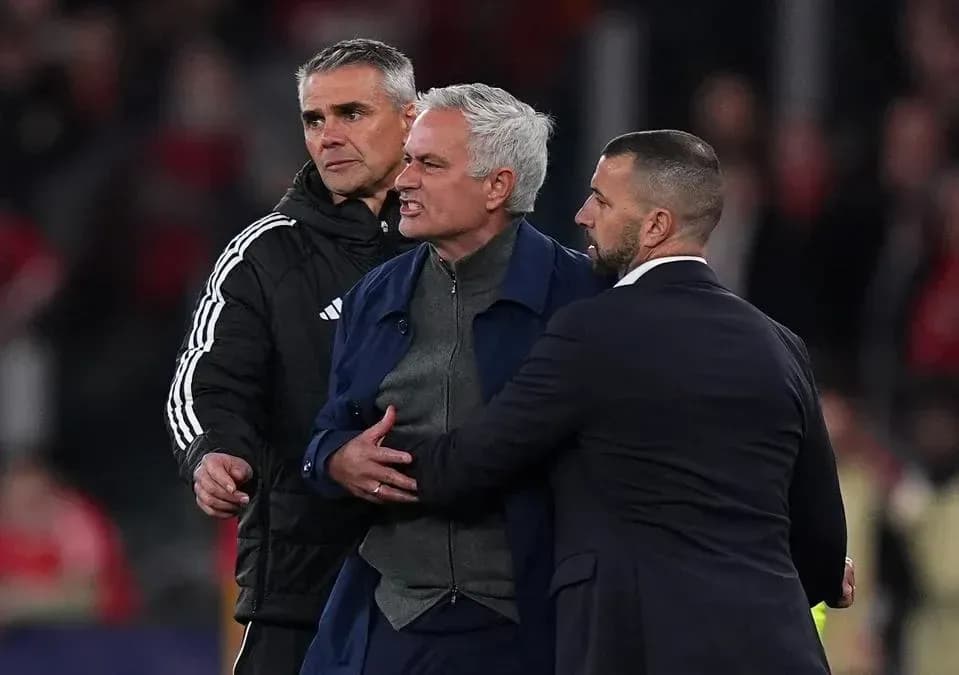 Trainers restraining coach during heated moment Trainers restraining coach during heated moment