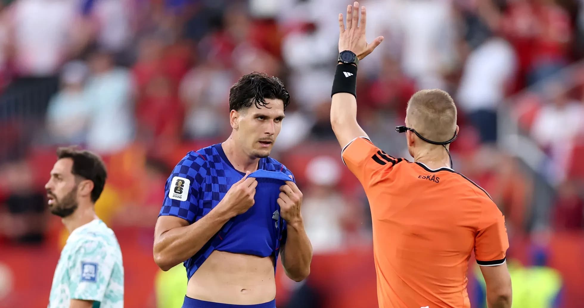 Referee showing a card to a player on field Referee showing a card to a player on field