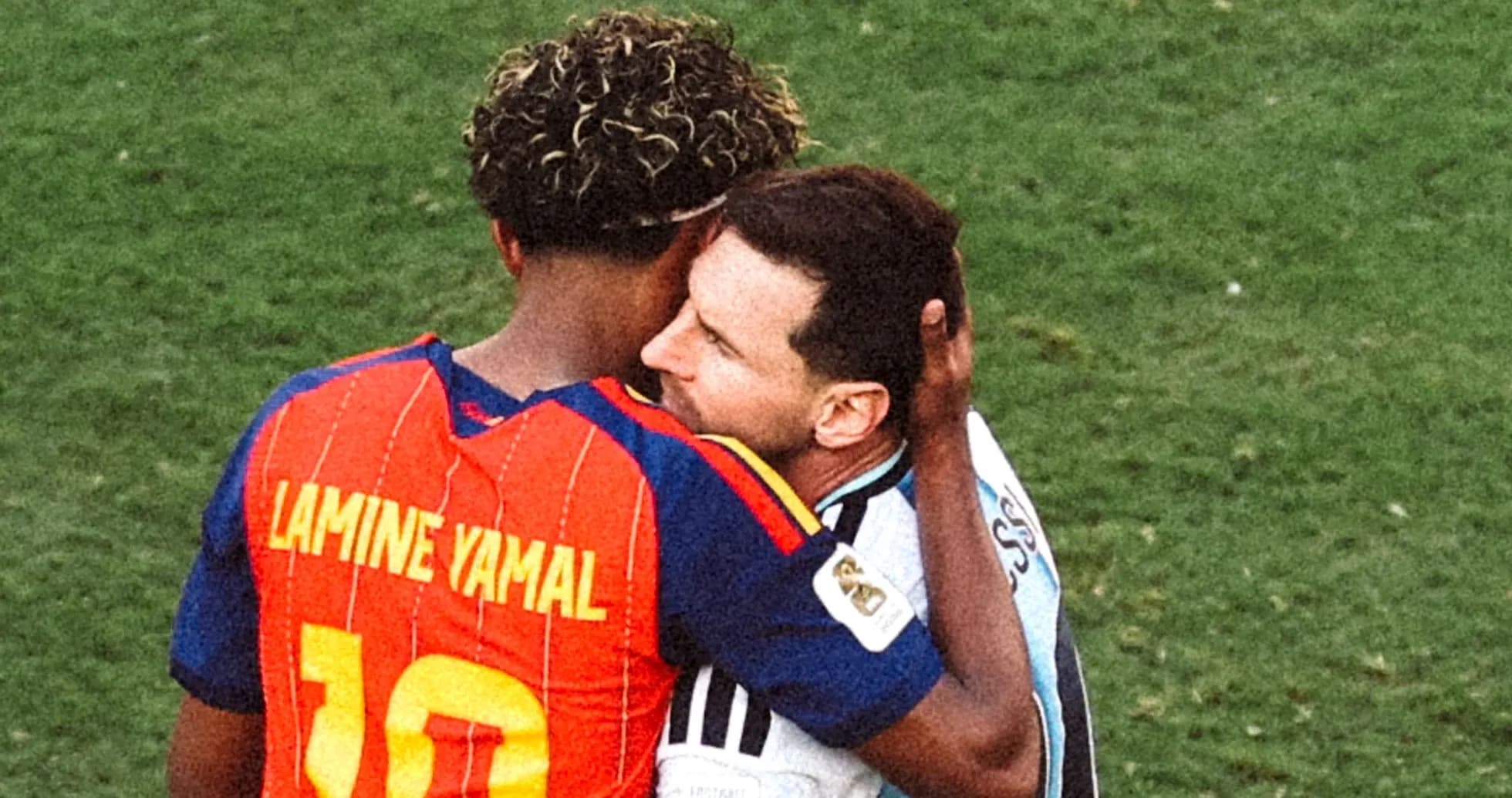 Lamine Yamal and Lionel Messi embracing on field Lamine Yamal and Lionel Messi embracing on field