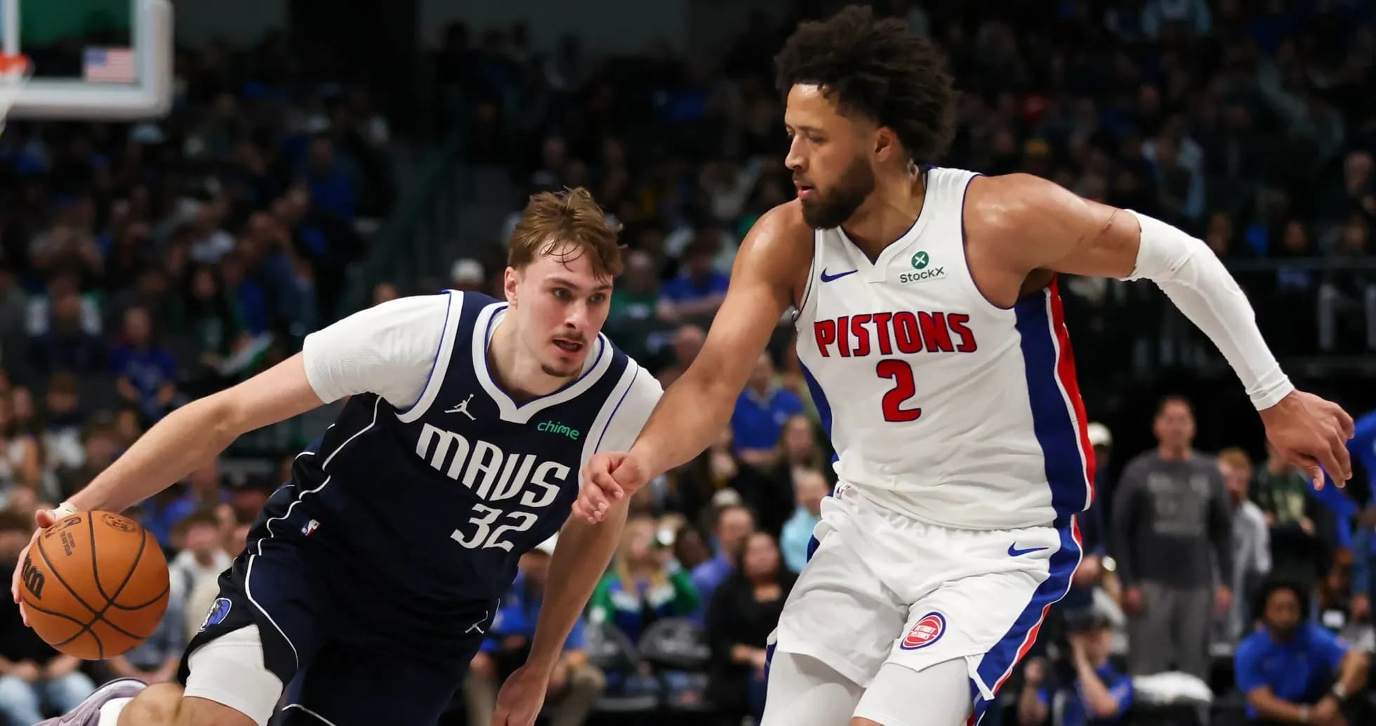 Two basketball players competing for the ball Two basketball players competing for the ball