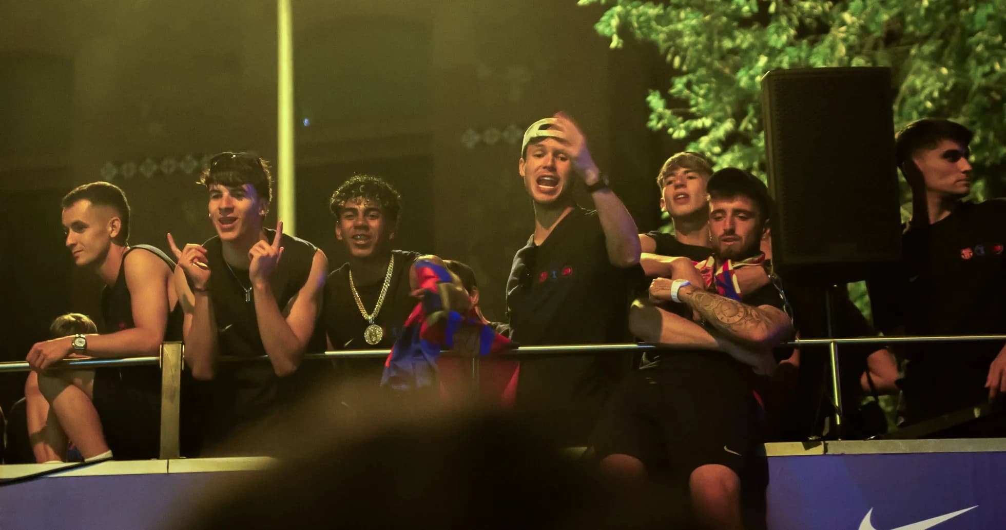 Fans celebrating on balcony during event Fans celebrating on balcony during event