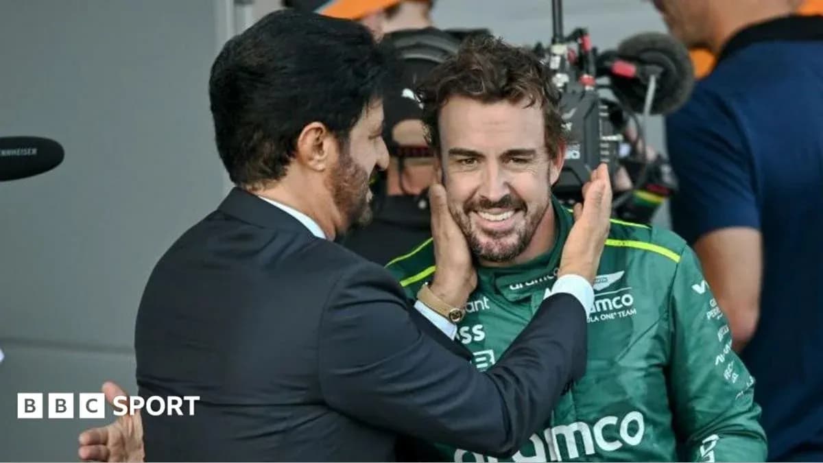 Fernando Alonso smiling during post-race celebration Fernando Alonso smiling during post-race celebration