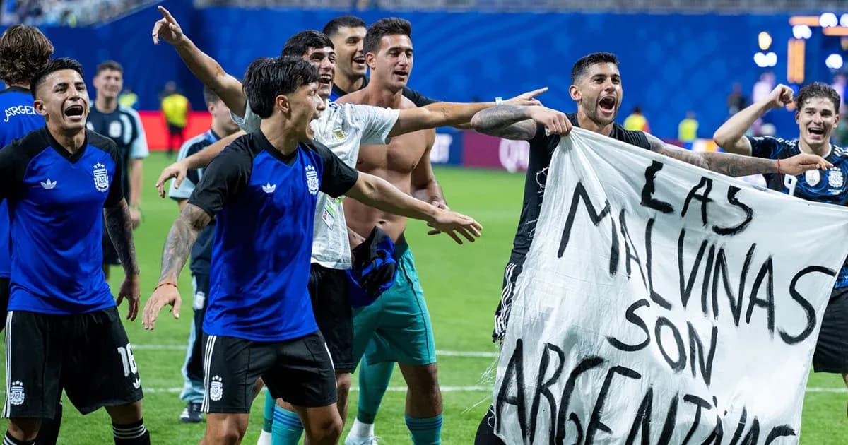 Argentinian players celebrating with a banner Argentinian players celebrating with a banner