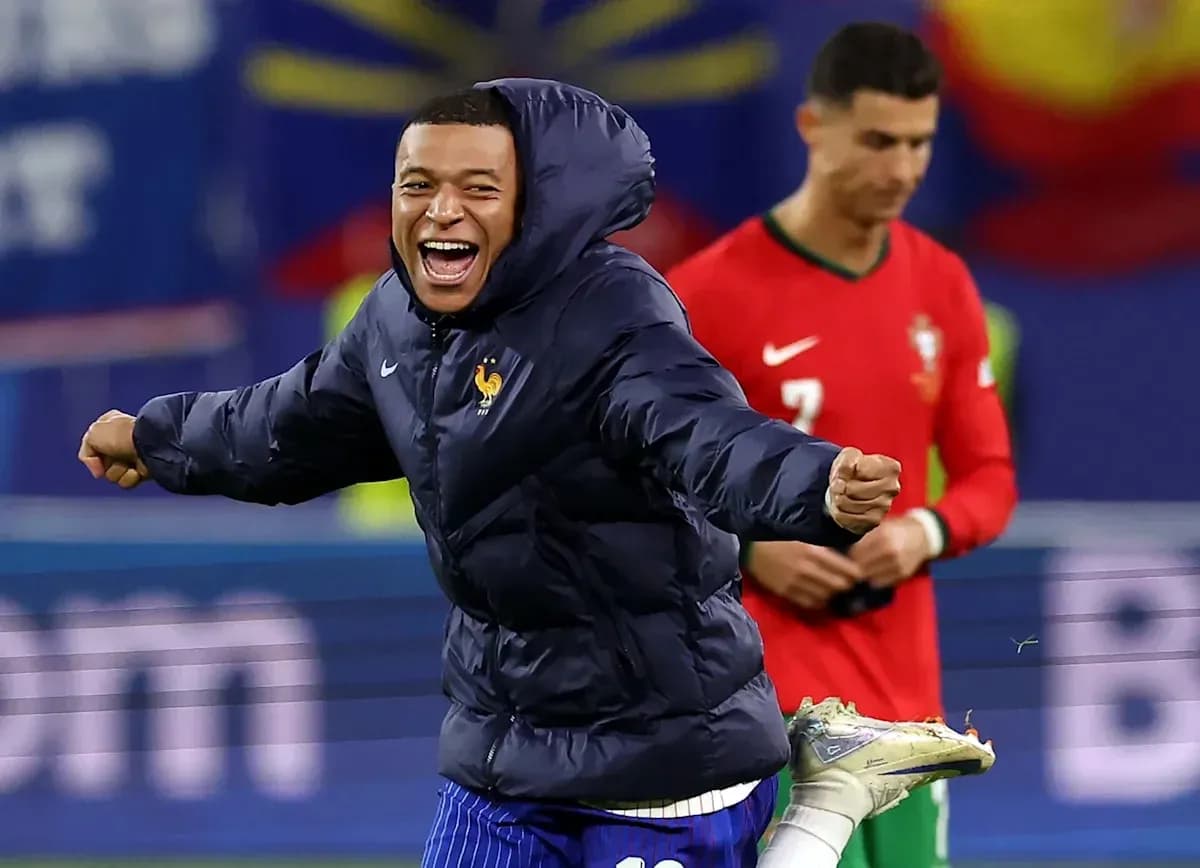 Mbappé celebrating in France jacket during match Mbappé celebrating in France jacket during match