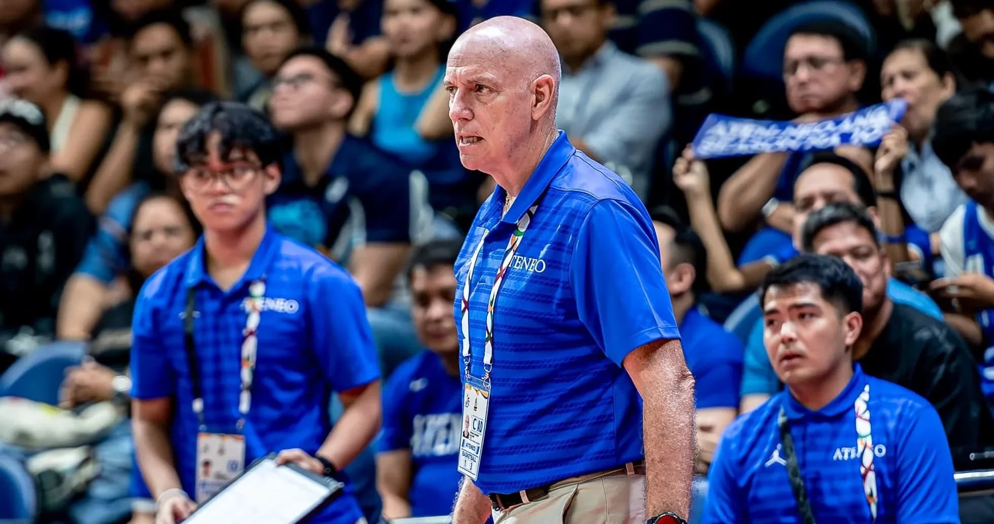 Bosh coach near players during intense match Bosh coach near players during intense match