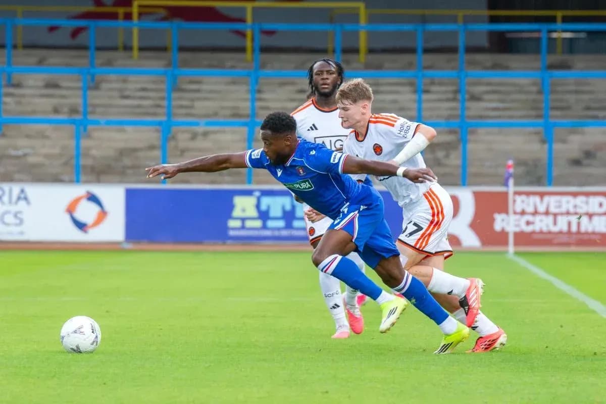 Player tackling opponent during football match action Player tackling opponent during football match action