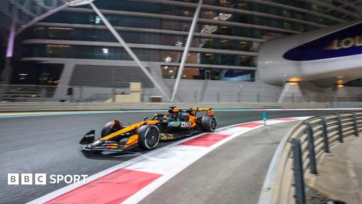 Formula 1 car racing on track at night Formula 1 car racing on track at night