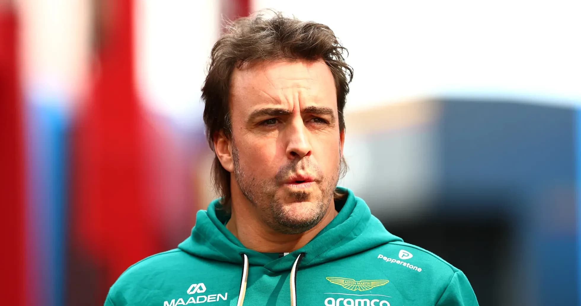 Formula 1 driver in Aston Martin team hoodie Formula 1 driver in Aston Martin team hoodie