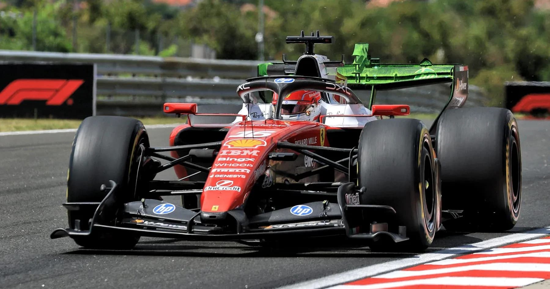 Ferrari F1 car racing on track during competition Ferrari F1 car racing on track during competition