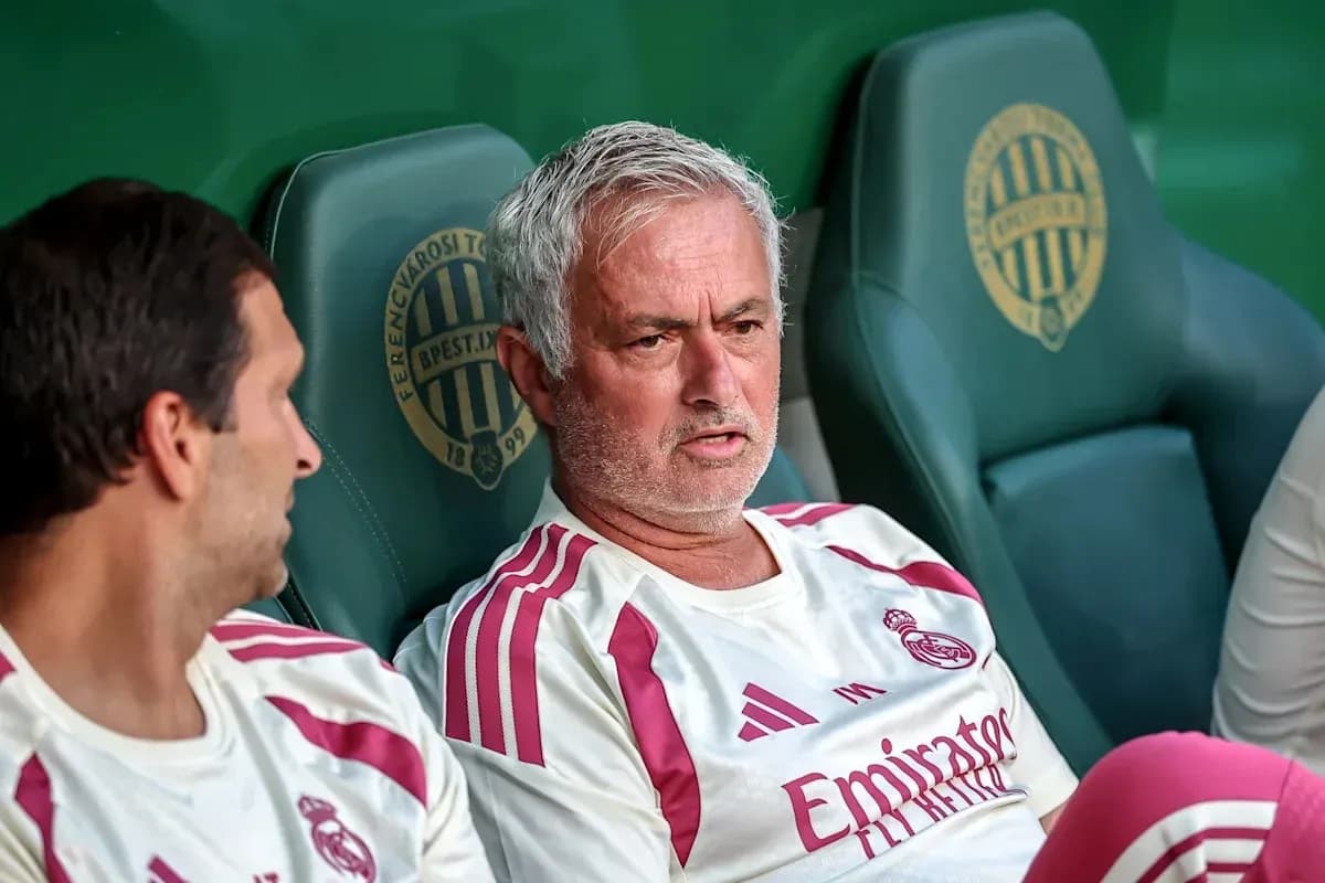 Mourinho sitting on bench with teammate during match Mourinho sitting on bench with teammate during match