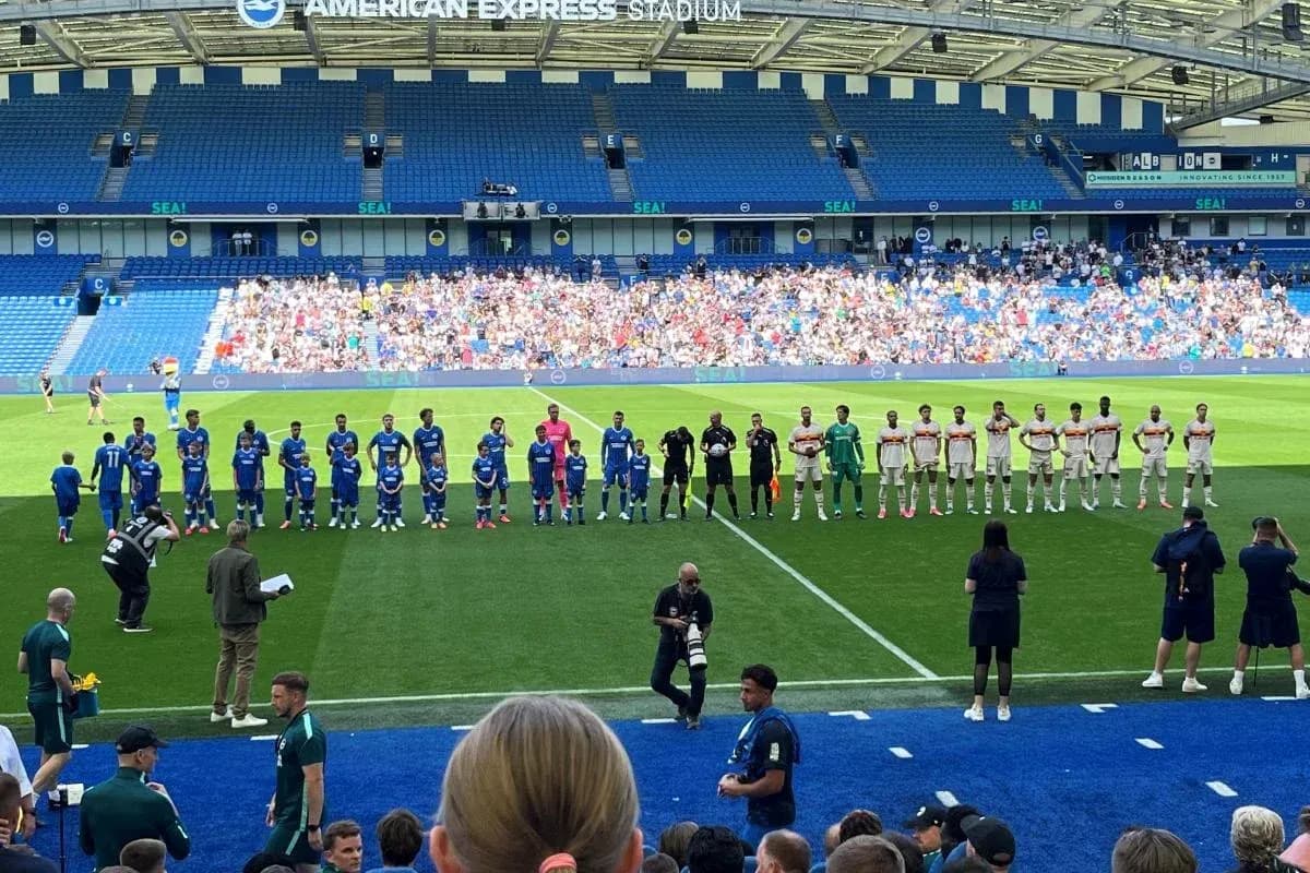 Football teams lined up before match at stadium Football teams lined up before match at stadium
