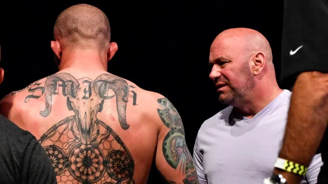 Man with tattoos talking to another man Man with tattoos talking to another man