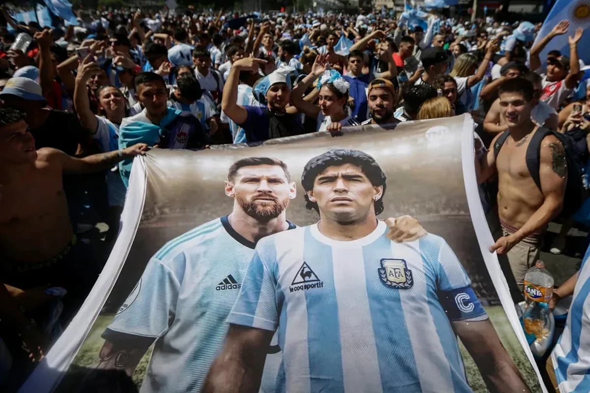 Fans holding banner of Messi and Maradona at celebration Fans holding banner of Messi and Maradona at celebration