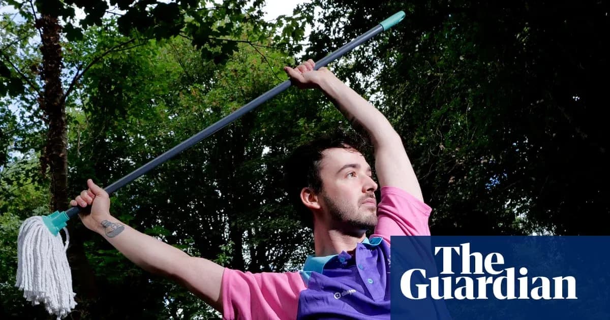 Shirtless person posing with a mop outdoors Shirtless person posing with a mop outdoors