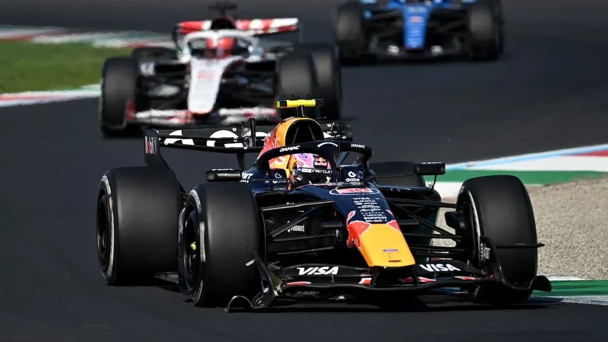 Formula 1 cars racing on track during competition Formula 1 cars racing on track during competition