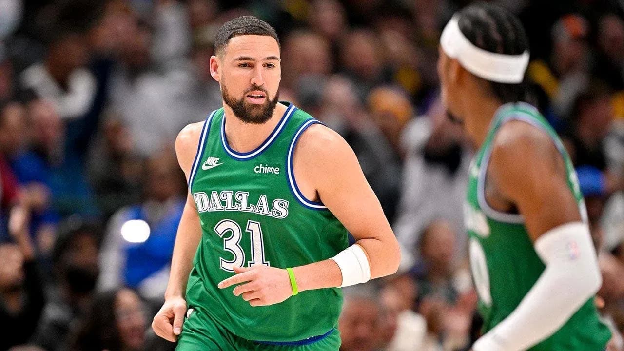 Basketball player in Dallas jersey during game Basketball player in Dallas jersey during game