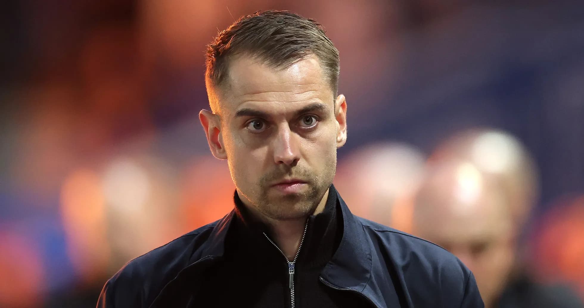 Coach walking on the sidelines during match Coach walking on the sidelines during match