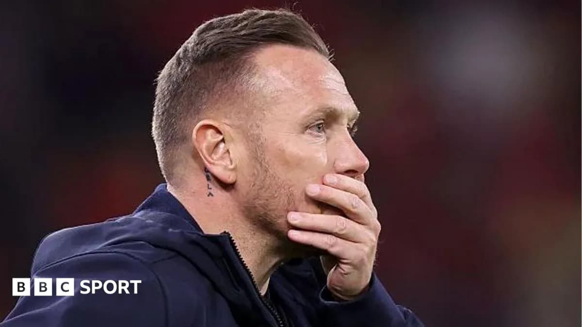 Coach with hand on face during match Coach with hand on face during match
