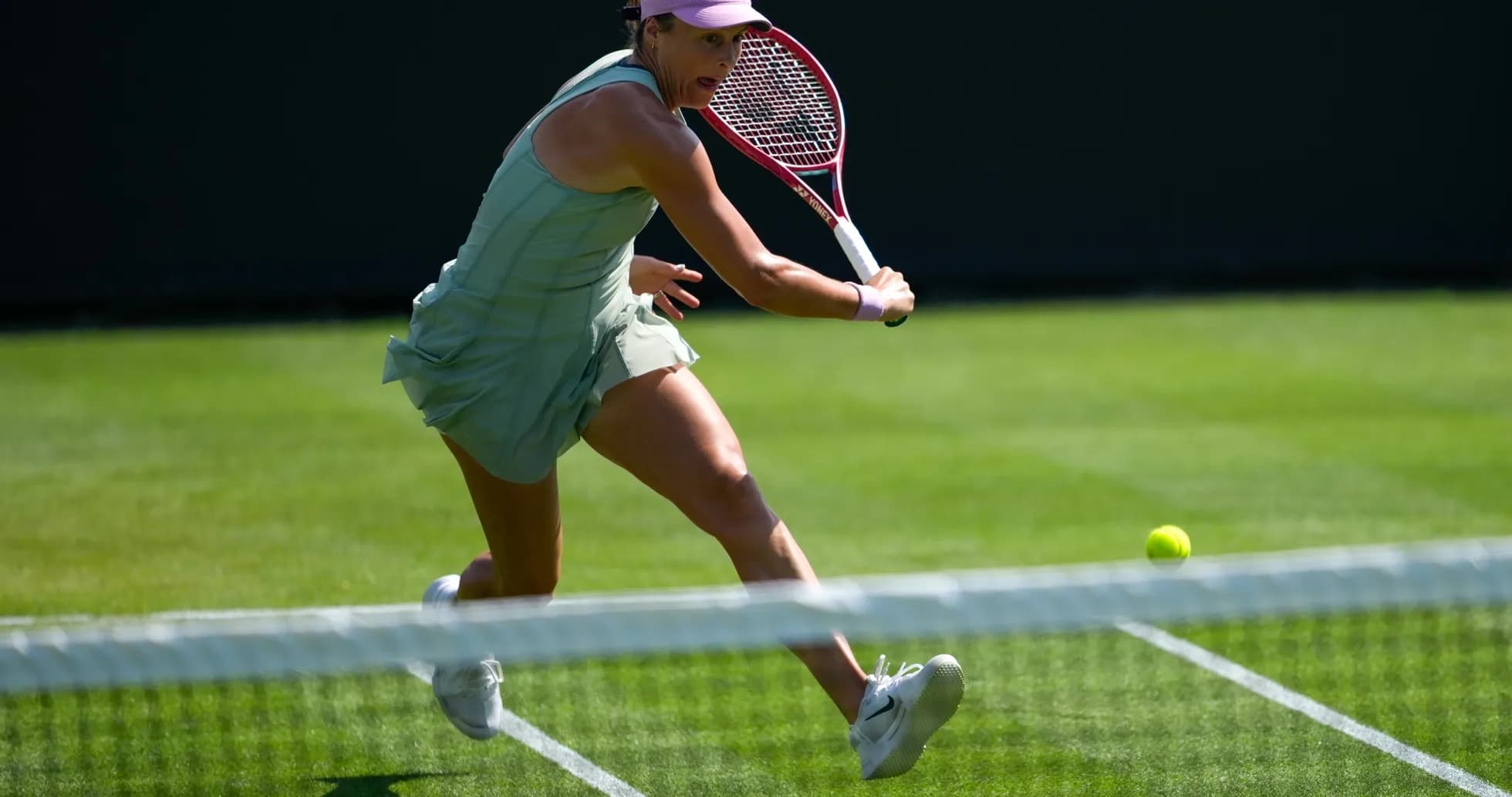 Tennis player hitting a ball during match Tennis player hitting a ball during match