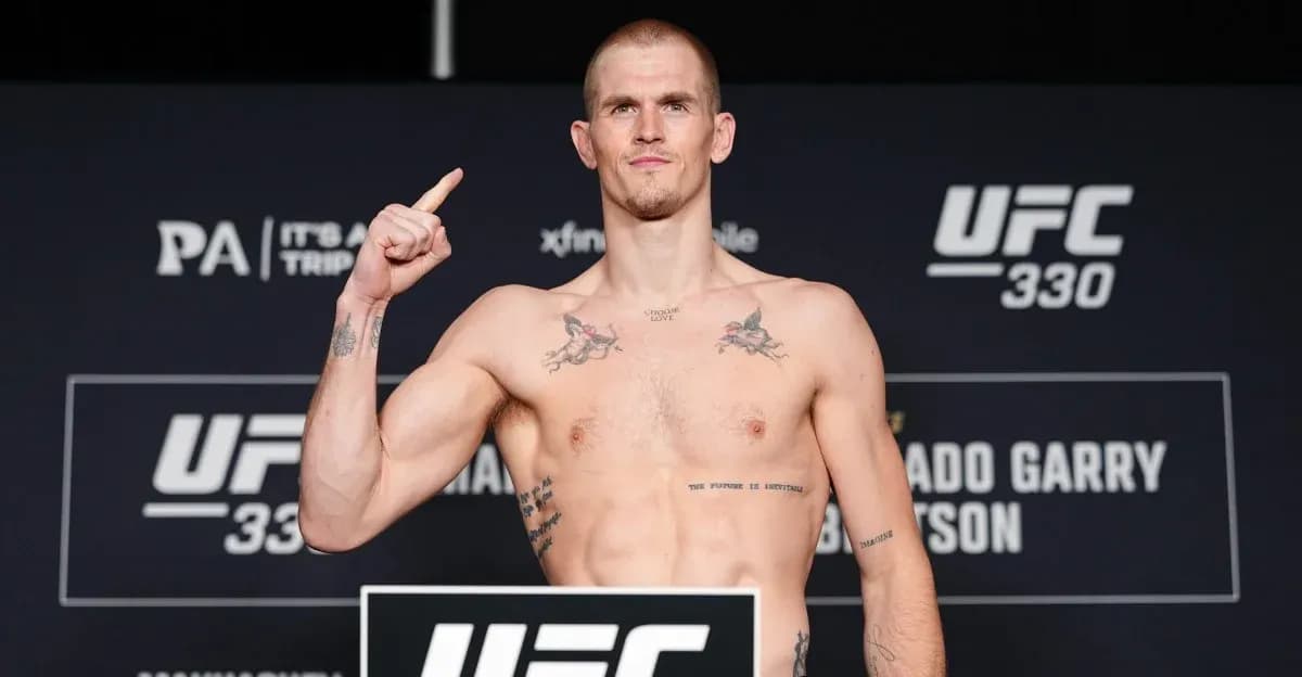 Fighter posing at UFC 330 weigh-in event Fighter posing at UFC 330 weigh-in event