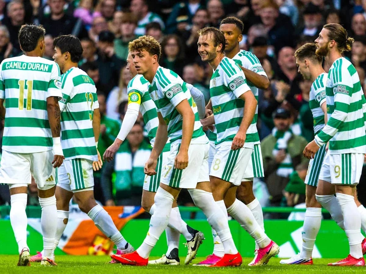 Celtic players celebrating a goal on the pitch Celtic players celebrating a goal on the pitch